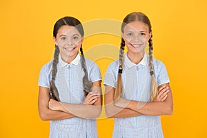 School authority. happy girls with pigtails. happy childhood. brunette and blond hair. best friends. vintage style