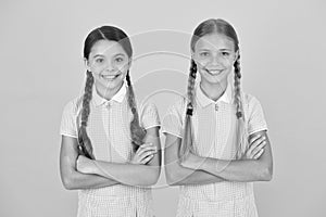 School authority. happy girls with pigtails. happy childhood. brunette and blond hair. best friends. vintage style