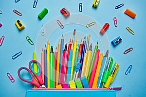 School background. Pencil case with bright office supplies