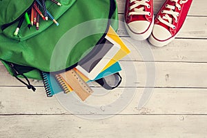 School backpack on wooden background photo