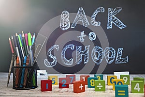 School blackboard with text `Back to school` . September and education concept