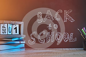 School blackboard with text `Back to school` . September and education concept