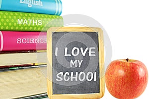 School books with apple and black board back to school