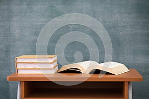 School books on desk, Books and blackboard on wooden background, education concept