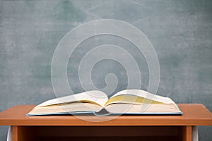 School books on desk, Books and blackboard on wooden background, education concept