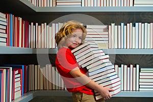 School books and education concept. Kid nerd pupil reads books in the library. Schoolboy with book in class. Literature