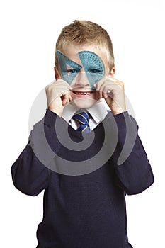 School boy with blue set square and protractor