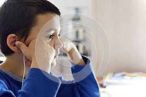 School boy on distance learning at home.