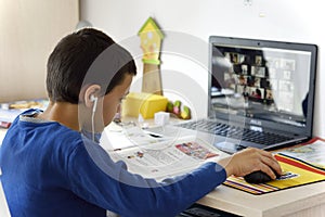 School boy on distance learning at home.