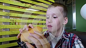 School Boy Eating Hamburger