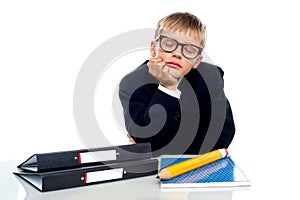 School boy in glasses dozing off