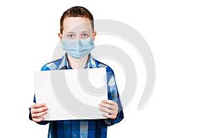 School boy hold blank sign with copy space, wearing a protective face mask prevent virus infection, isolated