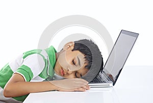 School Boy Sleeping over the laptop