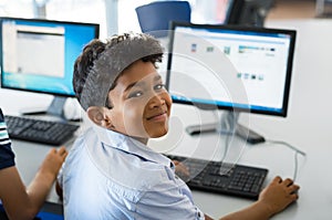 School boy using computer photo