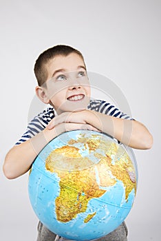 School boy with world globe