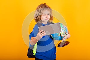 School boy world globe and tablet. Kid boy from elementary school with book. Little student, smart nerd pupil ready to