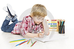 School boy writing exercise in notebook. Schoolboy do homework