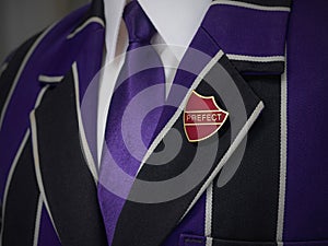 School boys blazer with prefect school badge photo