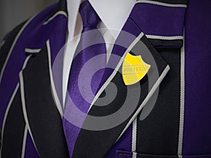 School boys blazer with prefect school badge photo