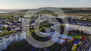 School building in dwelling district of city aerial view