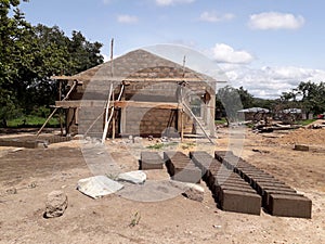 School building under construction in an undeveloped country. Developing countries and relief work context. School for