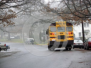 School bus on the street in weather