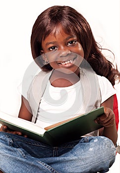 School child girl reading book.