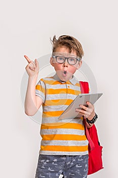 School child in glasses. Kid boy hold. Book certificate. Successful education. Cute child boy in school uniform and