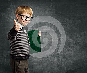 School Child in Glasses Thumbs Up, Kid Boy Hold Book photo