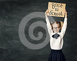School Child over Blackboard Background, Girl Advertise Board photo
