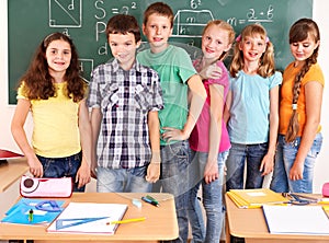 School child sitting in classroom.