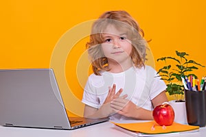 School child using laptop computer. Smart caucasian school boy kid pupil student going back to school. Education kids