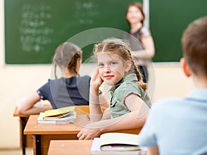 School children in classroom at lesson