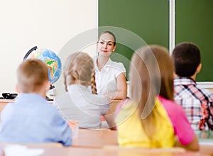 School children in classroom at lesson