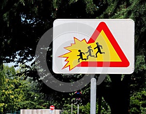 School children crossing zone, caution. Warning sign .