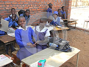 School children in incomplete classroom building.