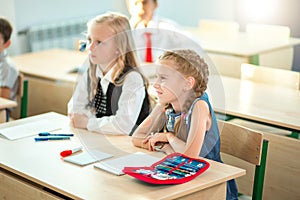 School children participating actively in class. Education, learning, high school