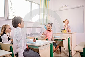 School children participating actively in class. Education, learning, high school