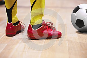 School children playing indoor soccer at physical education class