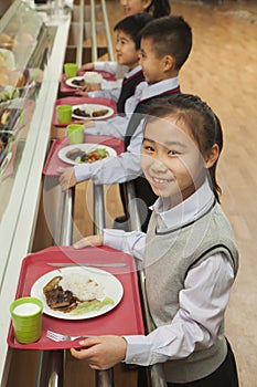 School children standing in line in school cafeteria