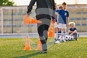 School coach preparing field for soccer training
