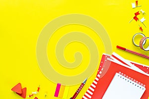 School colorful stationery on yellow background with copyspace