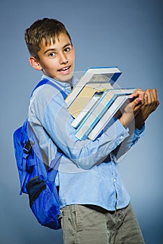 School concept. portrait successful happy boy with knapsack holding books