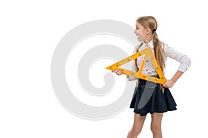 School concept. Small child with measuring instrument school lesson. Little girl preparing for geometry lesson. Cute