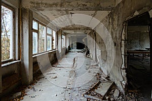 School corridor, dead abandoned ghost town Pripyat in Chernobyl exclusion zone 32 years without people, Ukraine