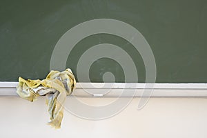 School desk with chalk on the shelf