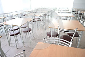 School dining room with a lot of tables and chairs