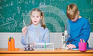 School education. Chemical analysis. Kids study chemistry. School chemistry lesson. School laboratory. Girl and boy