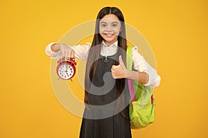 School and education concept. Back to school. Schoolchild, teenage student girl with clock alarm, time to study. Happy