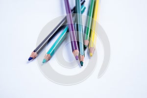 School equipment: colored pensils on white background